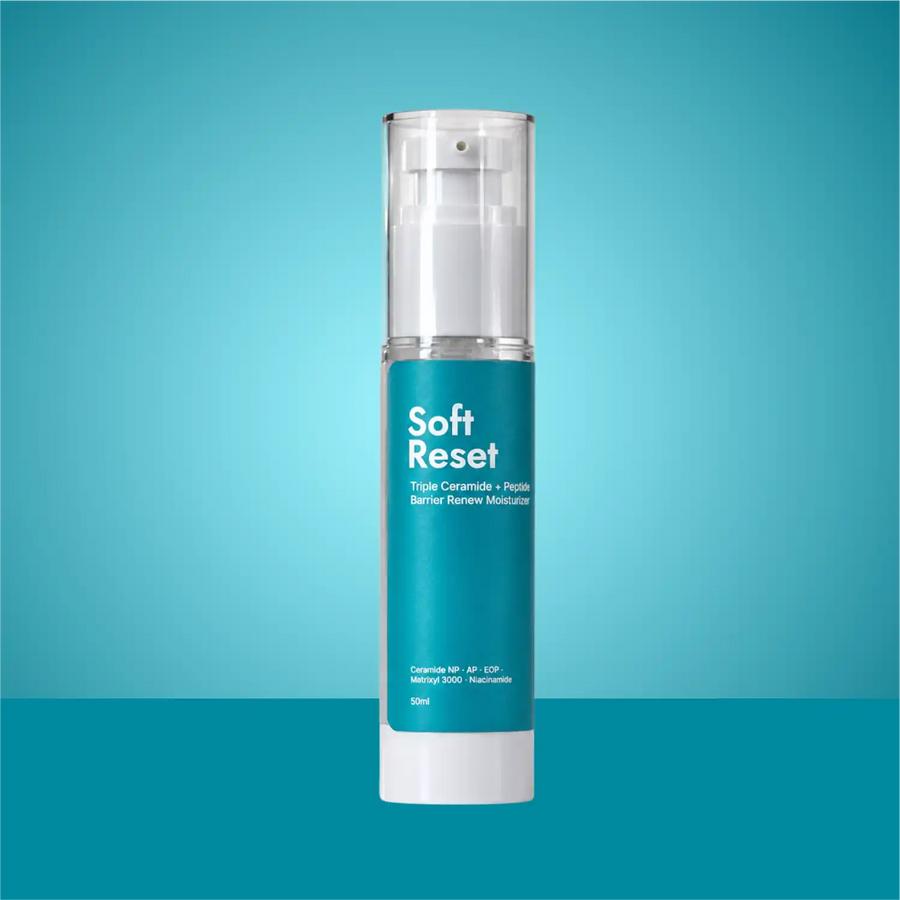 Soft Reset ceramide barrier repair moisturiser in a teal 50ml pump bottle on a blue background